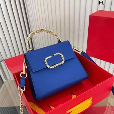 China New motion detection trend joker hand chain bag fashion office worker large capacity studded handbag for sale