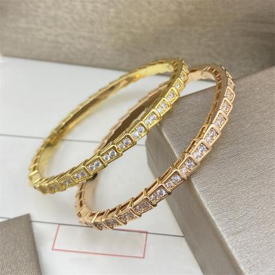 China Other nude titanium bangle has head and tail full faux stone snake bone snake bracelet spring fashion trend luxury head and tail piercing buckle bracelet for sale