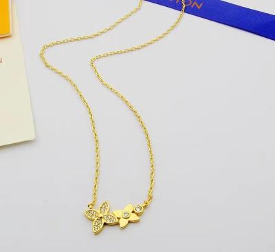 China Fashionable double flower necklace earrings set small fresh style classic soft simple product selection Germany imported Asian gold pla for sale