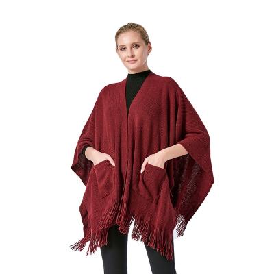 China Knitted tassel with pockets knitted shawl with pockets women cape knitted cappa for sale