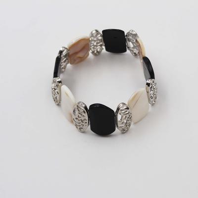 China New Classic TRENDY Fashion Shell Hammered Alloy Charm StretchBracelet Black White Broom For Women for sale