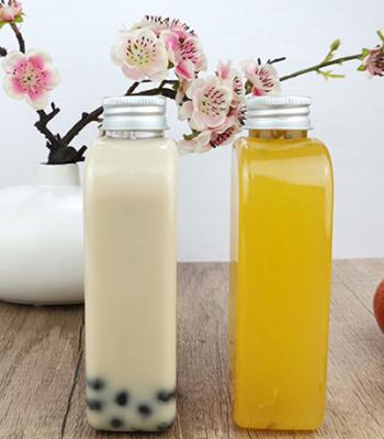 Cina Bottiglie beventi di plastica piane di Juice Milk 400ml con il cappuccio in vendita