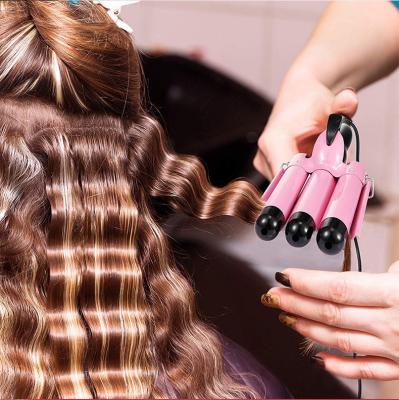 China Multi-temperature degree 3 barrel hair curling LCD display hair curler salon style ceramic curling iron for sale