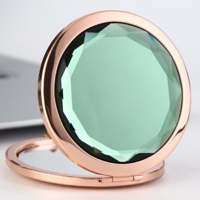 China Custom Fashion Glitter Printing Pocket Folding Magnifying Cosmetic Mirror With Gold Plating for sale