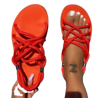 China 2021 fashion trend new product summer border large size hollow cross rope beach braided flat shoes women's sandals for sale