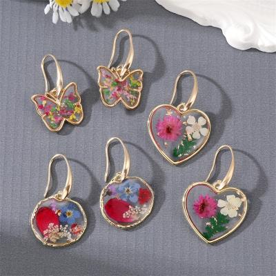 China New FASHIONABLE dry butterfly European and American pastoral geometric transparent eternal heart flower earrings wholesale for sale