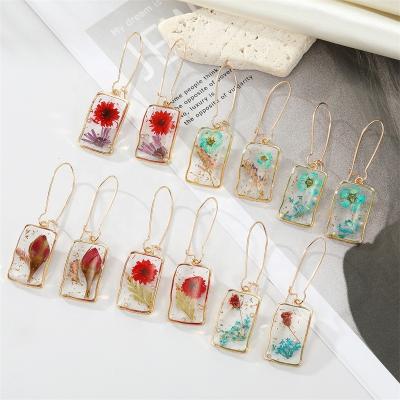 China Personality FASHIONABLE Korean creative irregular rectangle transparent glue drop jewelry dry pearl flower eternal earrings for sale