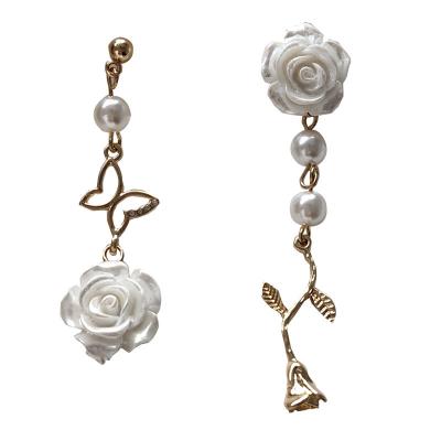 China Trendy New Fashion s925 Needle and White Rose Asymmetrical Butterfly Pearl Stud Earrings for sale