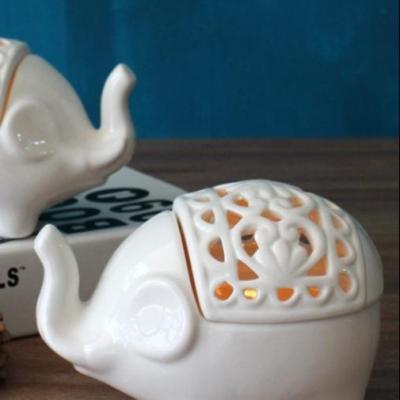 China Home Decoration Cavity Elephant Aroma Ceramic Candle Holder Ornaments Superfluous Object Modern Home Decoration for sale