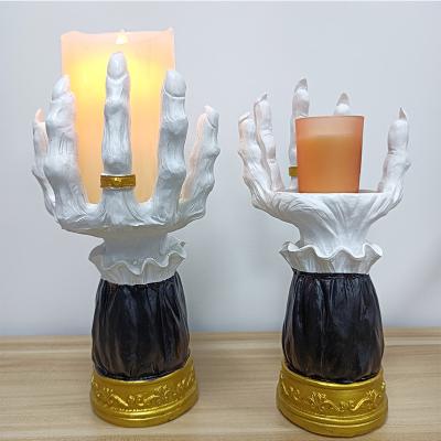 China New Home Decoration Halloween Palm Candle Holder Resin Open Candle Utensils Horror Witch Hand Seat Single Wick Candle Holder for sale