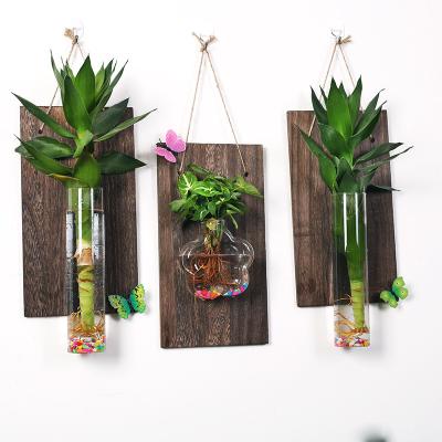 China Green Small Creative Home Hydroponic Radish Plant Decoration Background Wall Solid Wood Glass Vase for sale