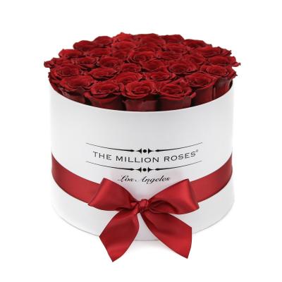 China Recycled Materials Wholesale Luxury Round Cardboard Flower Gift Box With Ribbon Bow for sale