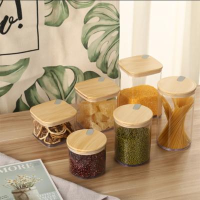 China KJH 680ML BPA Viable Free Living Clear Square Plastic Food Storage Container Airtight Sets With Wooden Lid for sale