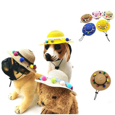 China Summer dog hat cute pet hat hair ball and colorful stocked dog straw hat sunshade designer dog for sale