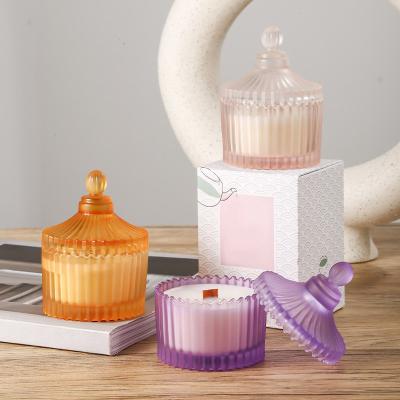 China Eco Fashionable Wholesale Wooden Soy Wax Wick Scented Candles In Colorful Crystal Glass Candy Jar Custom for sale