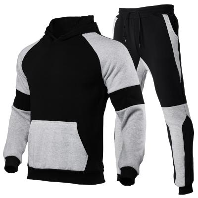 China New Design Custom Mens Tracksuit 2 Tones Breathable Splice Front Pocket Hooded for sale