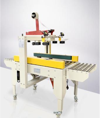 China Semi Automatic Left And Right Food Drive Belt Band Box Carton Sealing Machine for sale