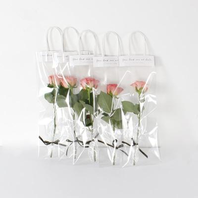 China Recyclable Clear PVC Moisture Proof Plastic Bag For Flower Gift Waterproof Pink Flower Package Bag Opp Plastic Carry Bags With Handle for sale