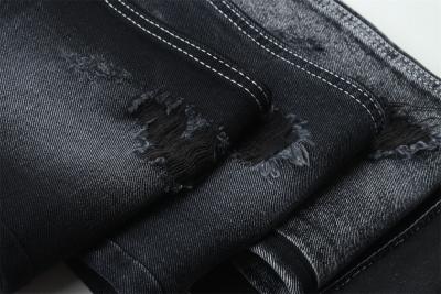 Cina 11.5oz nero scuro e nero retro denim tessuto rigido jeans tessuto per il marchio stile jeans ragazzo stile amico in vendita