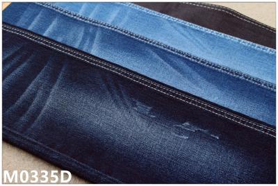 China 9.5 oz Eco Friendly Dark Indigo Stretchy Jean Material For Lady Soft Hand Feel Recycling for sale