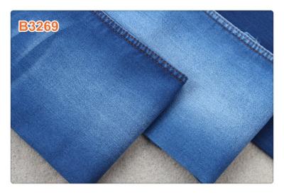 Cina 8,5 i jeans di Oz mettono il tessuto in cortocircuito leggero del denim del tessuto del denim dell'estate cruda dei pantaloni in vendita