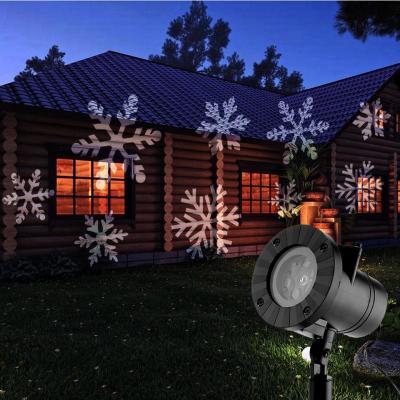 China Simple Outdoor Led Christmas Lights 12 Picture Projector Light Waterproof For Halloween Holiday for sale