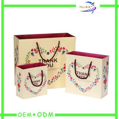 China Fancy Cosmetic Custom Paper Shopping Bags Rope Handle Coated Paper for sale