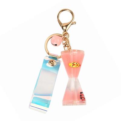 China Cute Jewelery Quicksand Floating Marine Doll Hourglass Key Chains For Girls Liquid Fashion Luxury Key Chain for sale