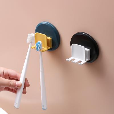 China Bathroom Viable Shelf Cup Mouth Wall Suction Toilet Set Punch Free Toothbrush Holder for sale