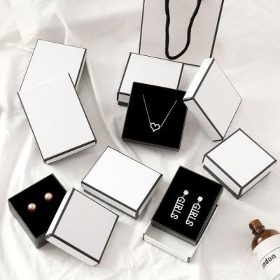 China Eco-friendly Jewelry Packaging Cardboard Paper Boxes Rectangular Jewelry Drawer Sponge Lined Black Cowhide Leather White Cardboard for sale