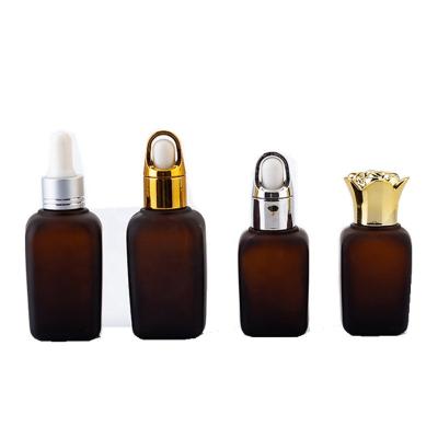 China Personal Care Square Oil Bottles 15ml 30ml 50ml Essential Amber Color Glass Essential Oil Press Dropper Bottles for sale