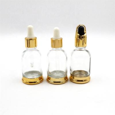 China Wholesale Recyclable 30ml Shoulder Oval Serum Dropper Bottle Metal Glass Cosmetic Bottle With Gold Dropper Cap for sale