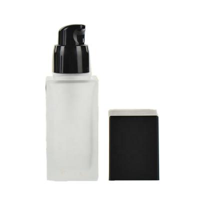 China Hot Selling Personal Care Cosmetic Lotion Frosted Base Glass Packaging Cylindrical Liquid Bottle With Pump for sale