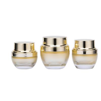 China Personal Care Custom Luxury Gold Whole Glass Set Bottle For Skincare Packaging for sale