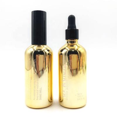 China Hot Sale 100ml Recyclable Gold Color Glass Essential Oil Plate Gold Glass Dropper Bottle With Cap Custom Wholesale for sale