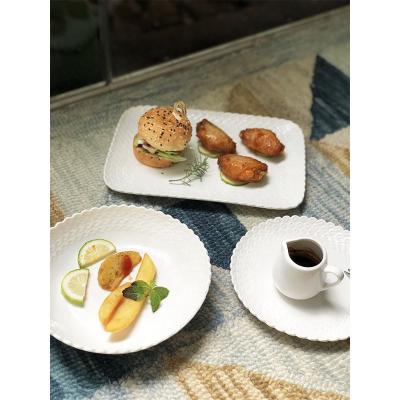 China Sustainable Customized Dish Set Nordic Style Embossed Modern Round Tableware Square White Porcelain Tableware Sets for sale