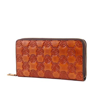 China Wear-resistant Long Style Top Layer Card Holder Elegant Handmade Leather Women Wallets With Embossed Pattern for sale