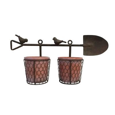 China Durable Hardware Flower Pot Holder with Clay Pot Plant Hanger Decorations for Home Outdoor and Indoor Metal Rack for sale