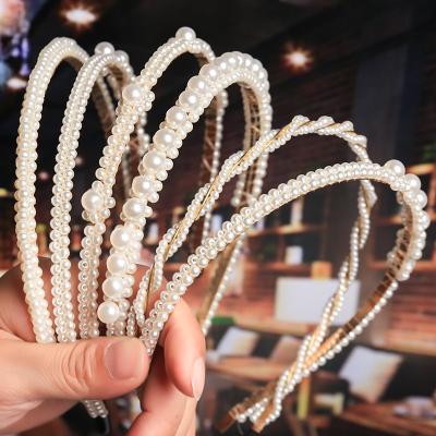 China Fashion Handmade Braid Pearl Wedding Hairband Thick Beaded Pearl Bow Headband For Women for sale