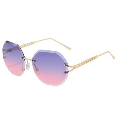 China Color rimless candy chunk ocean high quality fashion sunglasses polygon rimless sunglasses for sale