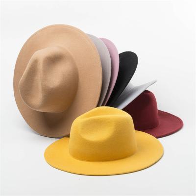 China Wholesale Plush Wool Felt Fadora White Unisex Flat Wide Brim Fedora Hat For Unisex Winter Wear for sale