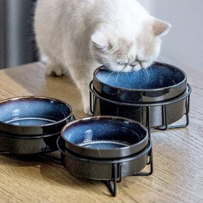 China Wholesale Sustainable Eco Friendly Reactive Luster Blue Round Custom Ceramic Pet Dog Food Feeder Bowl With Metal Stand for sale