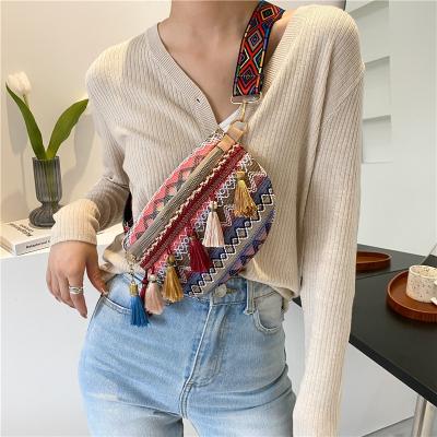 China 2021 New Style Straw Lady Saddle Bag Retro Ethnic Fashion Tassel Small Crossbody Chest Bag Large Capacity Casual Wide Female Bag for sale