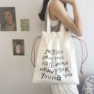 China 100% eco-friendly wholesale custom made tote bags of maiden letter canvas with strings for sale