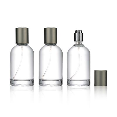 China Cosmetic 35ml 50ml 100ml Spray Glass Perfume Bottles With Cap Around Clear Perfume Glass Perfume Bottle for sale