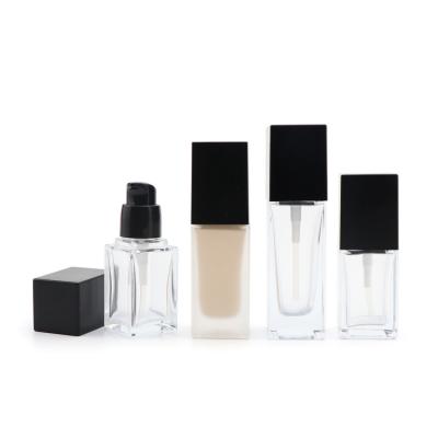 China Cosmetic Transparent Cosmetic Packaging Skin Care Glass Bottles 30ml Base Empty Flat Square Bottle for sale