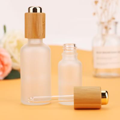 China 30 50 100ml Cosmetic Empty Skin Care Serum Container Frosted Glass Dropper Bottle With Bamboo Cap for sale