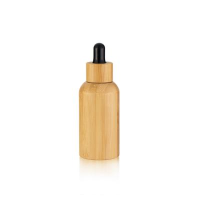 China Custom Round Empty Personal Care Packaging Skin Care Essential Oil Glass Cosmetic Bottles With Dropper Cap for sale