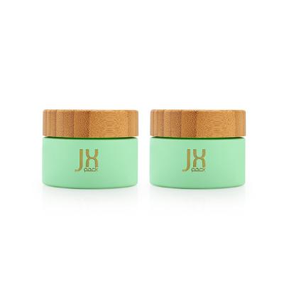 China Personal Care Natural Green Wooden Cream Jar 50ml Frosted Glass Cosmetic Cream Jar With Bamboo Lid for sale