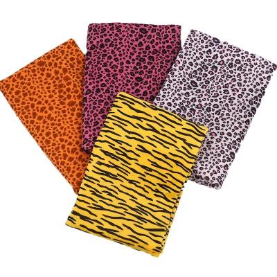 China 100% Flame Retardant Polyester Animal Print Garment Fabric Polyester Knitted Fabric for sale